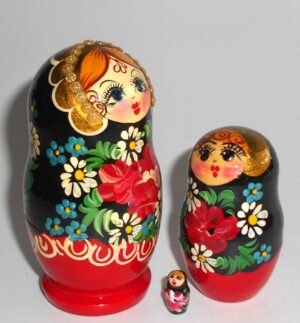 Girl in red & black floral dress nesting Doll Babooshki s