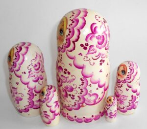 Girl in white and purple nesting Doll Babooshki s