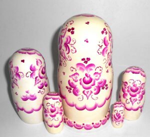 Girl in white and purple nesting Doll Babooshki s