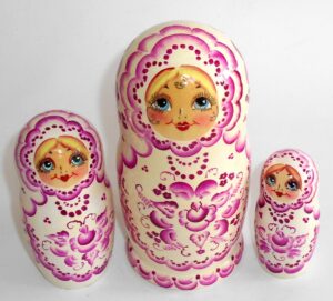 Girl in white and purple nesting Doll Babooshki s