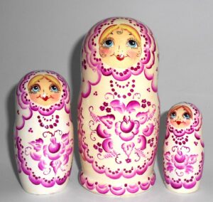 Girl in white and purple nesting Doll Babooshki s