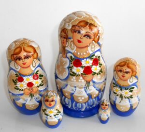 Bride in blue and white with mirrow Babushka Matryoshka nesting Doll Babooshki Babushkas