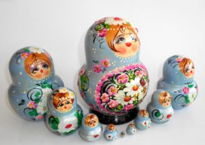 Girl in pale blue dress 10-set nesting Doll Babooshki s