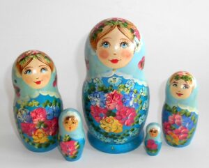 Klara small in light blue scarf dark blue dress Babushka Matryoshka nesting Doll Babooshki Babushkas