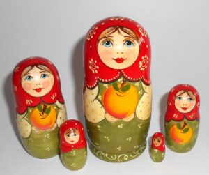 Kira in green dress with apple small Babushka Matryoshka nesting Doll Babooshki Babushkas