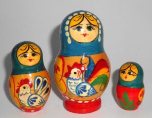 Girl with chicken blue scarf nesting Doll Babooshki s