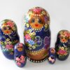 Girl in blue and gold outfit Babushka Matryoshka nesting Doll Babooshki Babushkas