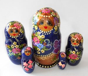 Girl in blue and gold outfit Babushka Matryoshka nesting Doll Babooshki Babushkas