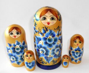 Girl in golden dress with blue flowers Babushka Matryoshka nesting Doll Babooshki Babushkas
