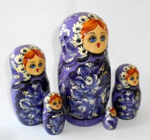 Village girl in purple outfit nesting Doll Babooshki s