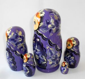 Village girl in purple outfit nesting Doll Babooshki s