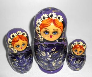 Village girl in purple outfit nesting Doll Babooshki s