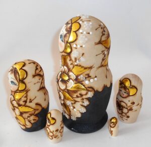 Village girl with gold flowers nesting Doll Babooshki s