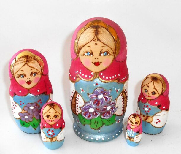 Village girl with purple flowers pink scarf nesting Doll Babooshki s