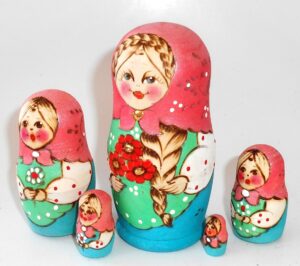 Village girl with plait and red flowers pink scarf nesting Doll Babooshki s