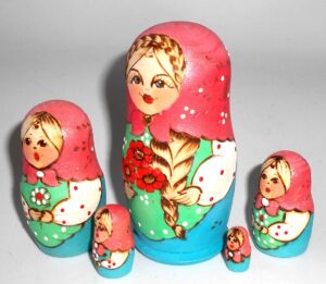 Stacey with plait blue dress nesting Doll Babooshki s