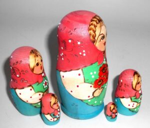 Stacey with plait blue dress nesting Doll Babooshki s