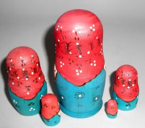 Stacey with plait blue dress nesting Doll Babooshki s